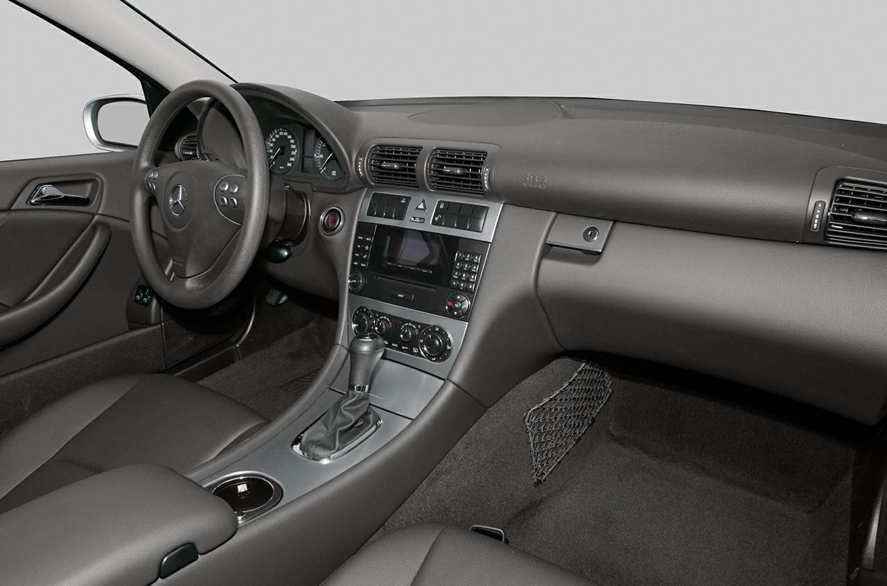 Dashboard and interior cabin with steering wheel and gear shifter