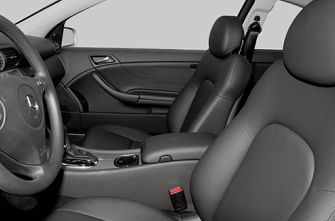 Leather seats and center console with steering wheel on car interior