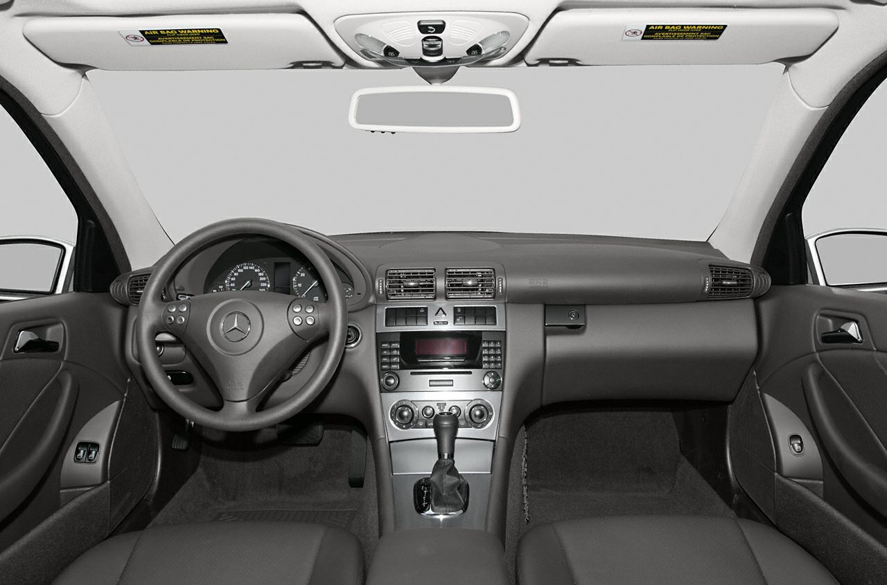 Steering wheel, dashboard, and center console of a 2001 coupe interior