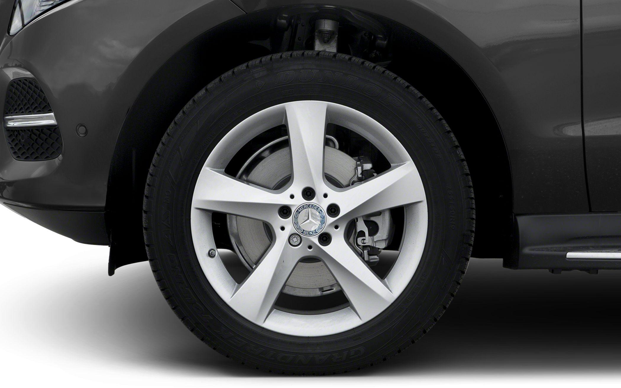 Five-spoke alloy wheel with visible brake disc and caliper