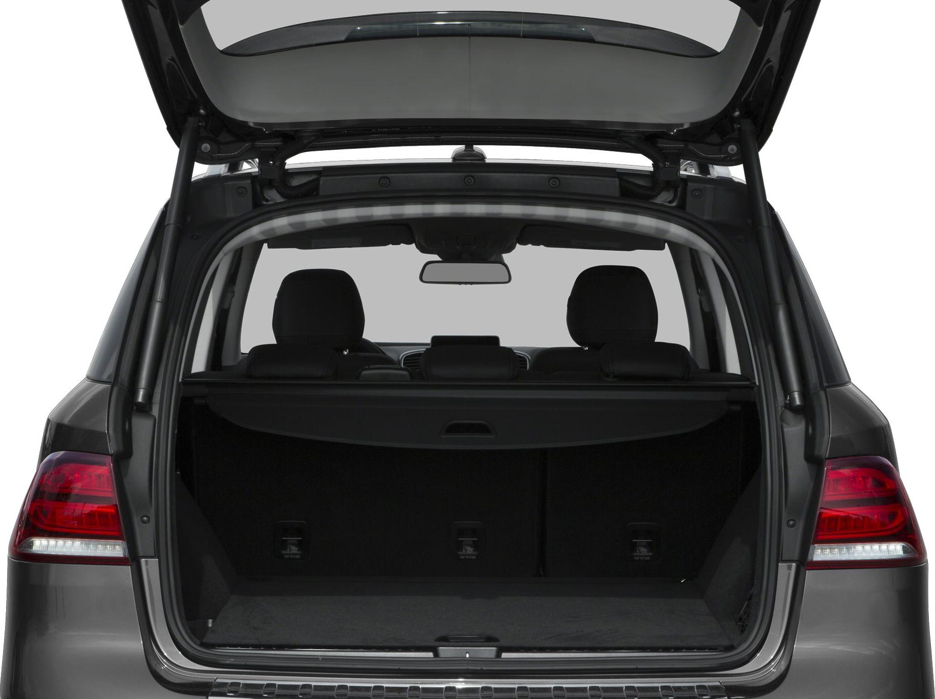 Spacious SUV cargo area with open tailgate and rear seats visible