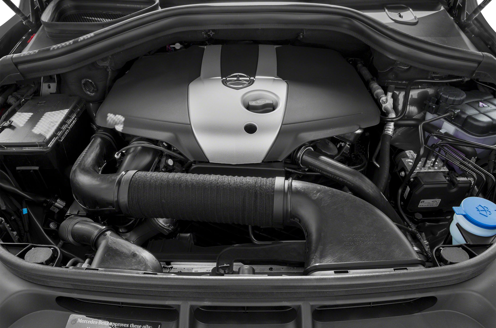 Engine bay featuring engine cover and intake system components