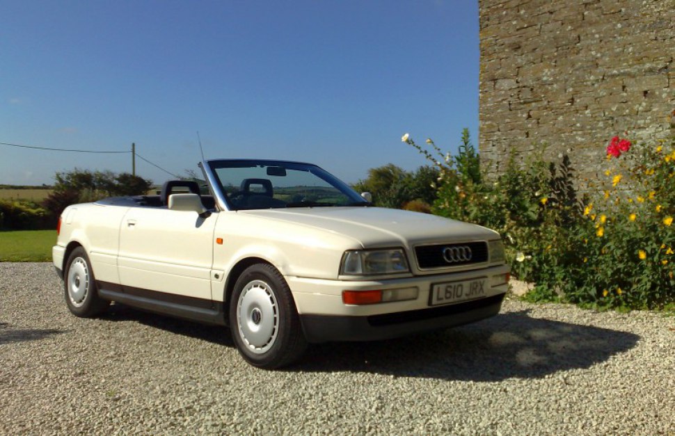 Cream white convertible with alloy wheels and soft top