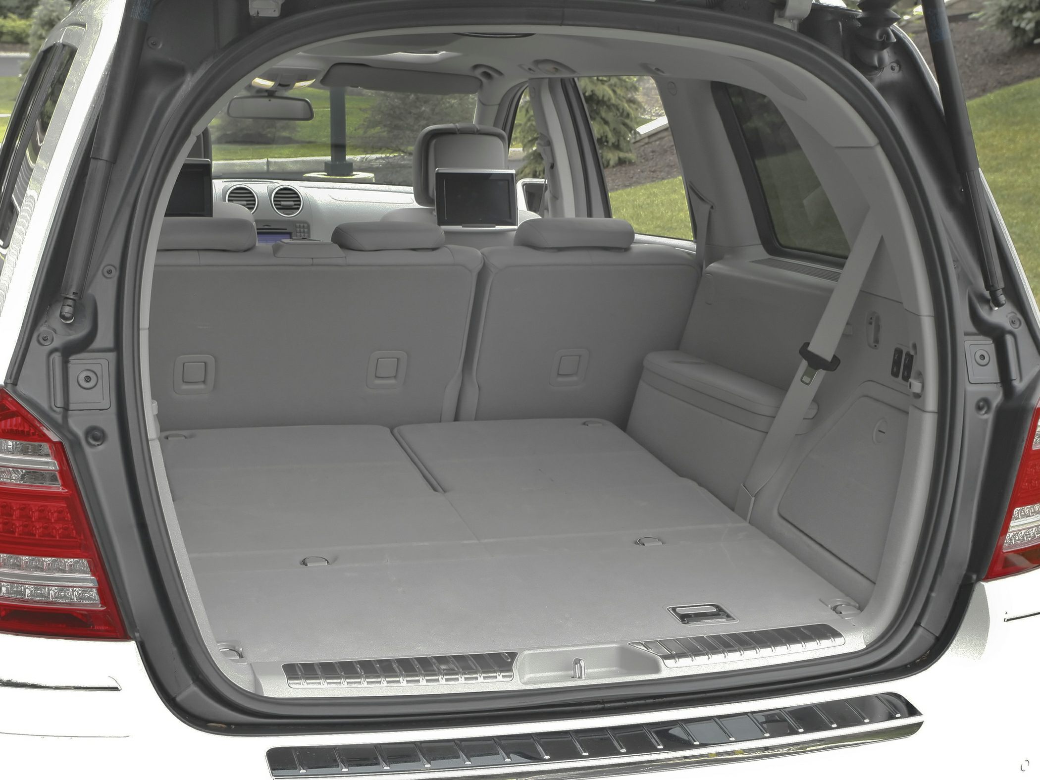 Folded rear seats with expansive cargo space and rear screens