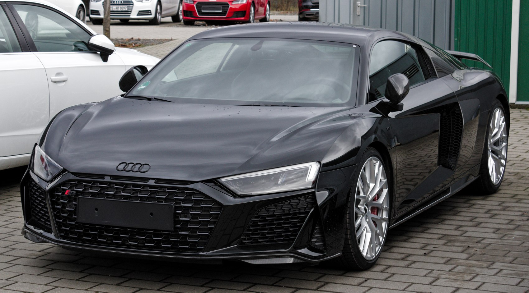 Front angled view with LED headlights and alloy wheels