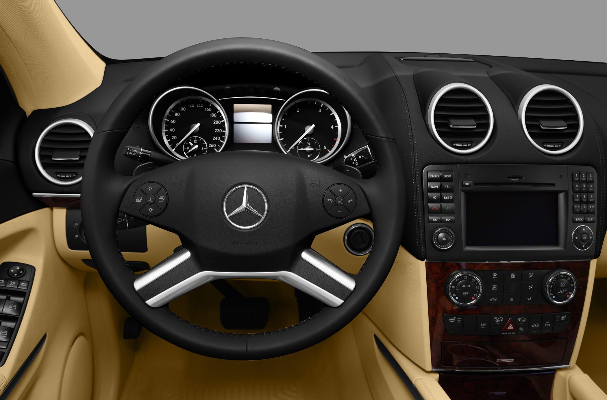 Steering wheel and dashboard with control panel in luxury vehicle interior