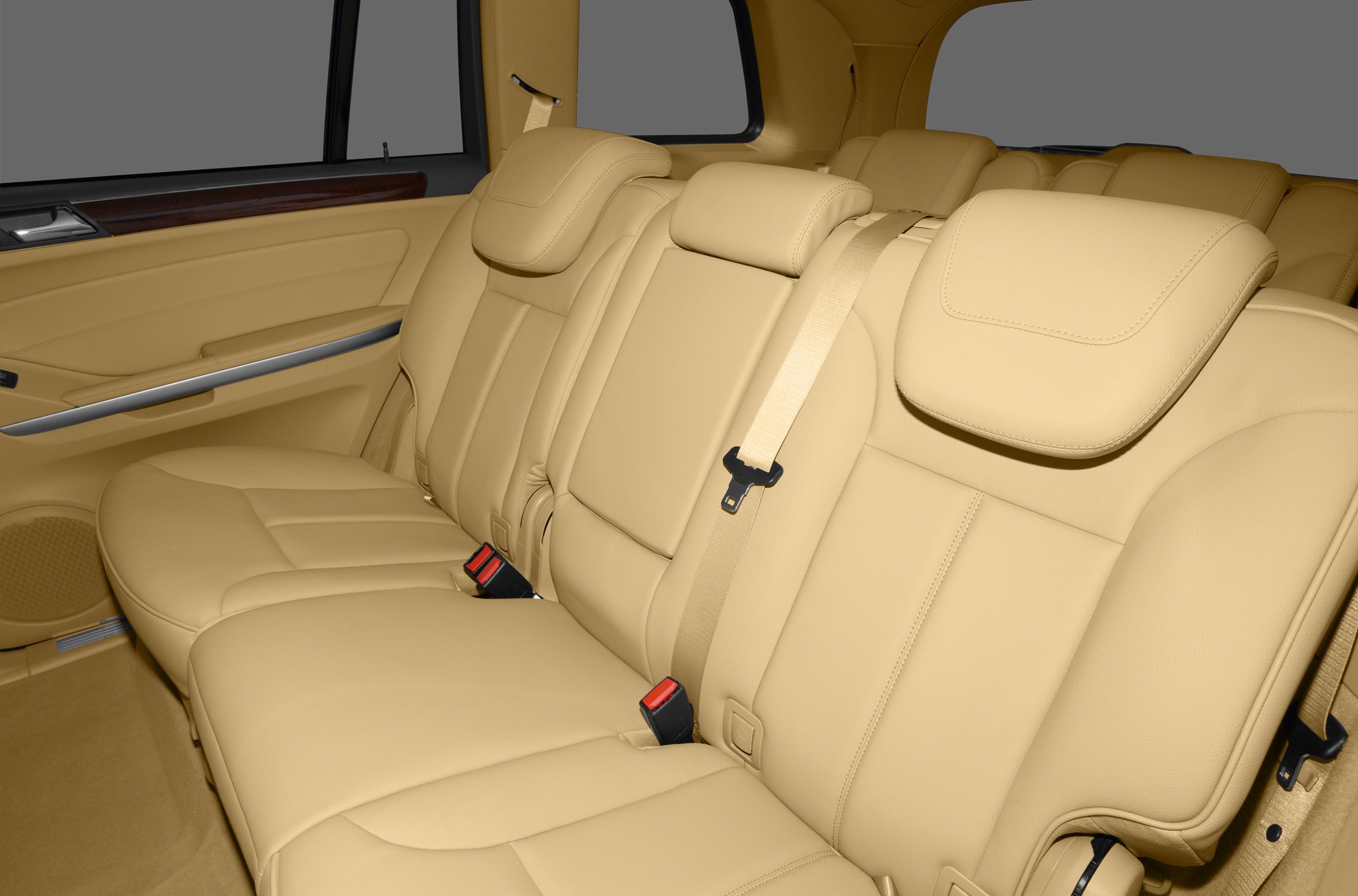 Beige leather rear seats with headrests and seat belts