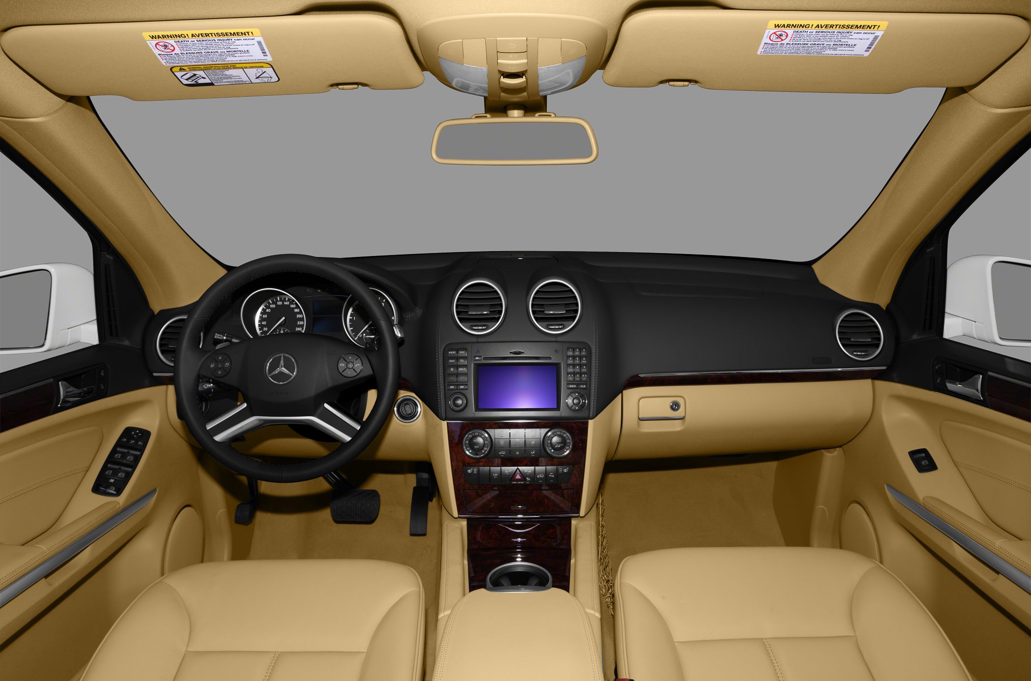 Luxury beige interior with dashboard, steering wheel, and infotainment system