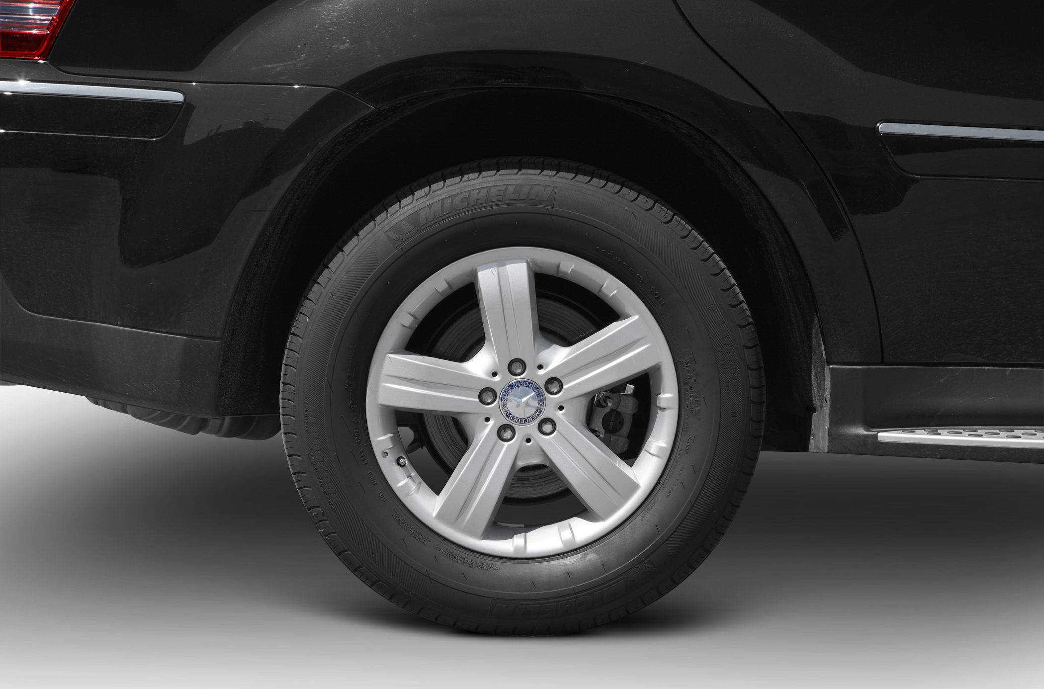 Close-up of alloy wheel and tire with brake disc