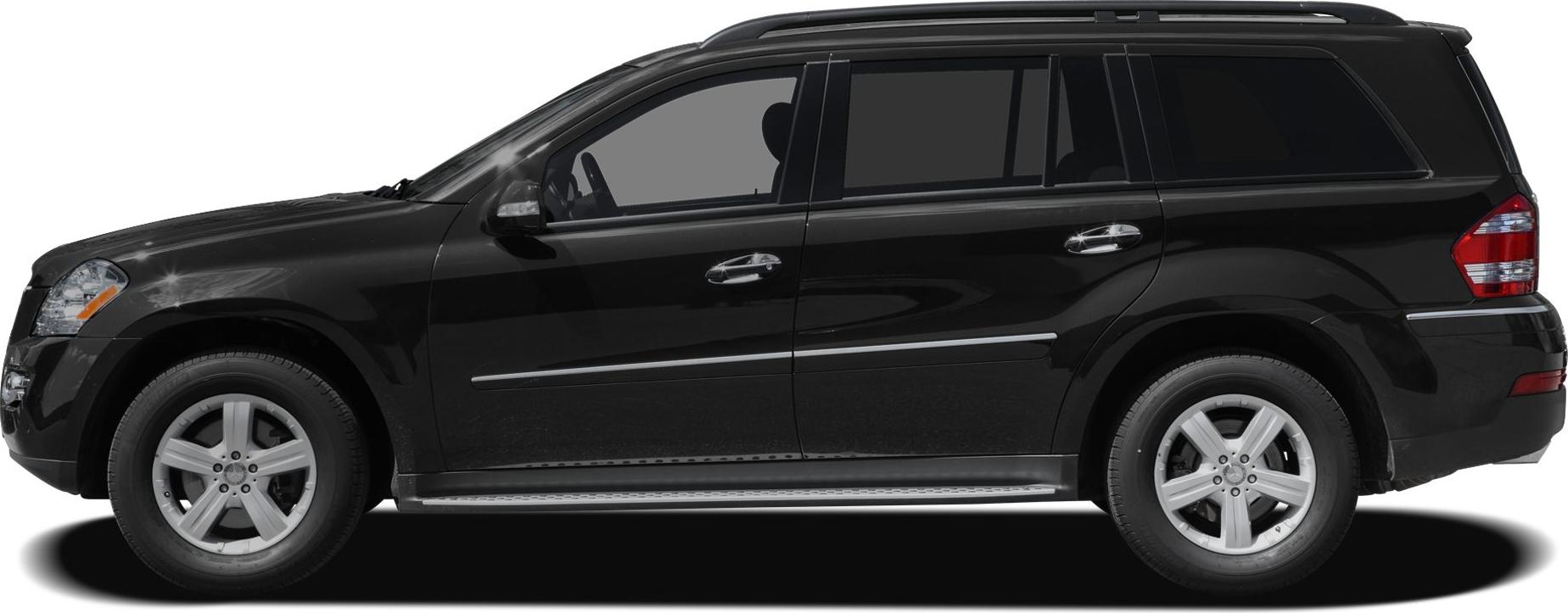 Side profile of black luxury SUV with alloy wheels and running boards