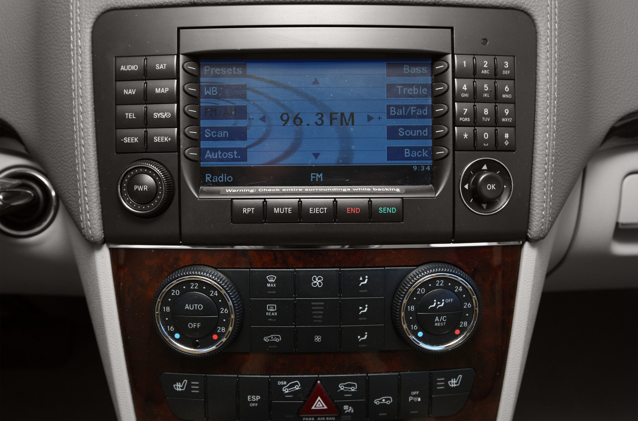 Center console with radio display and dual-zone climate control dials