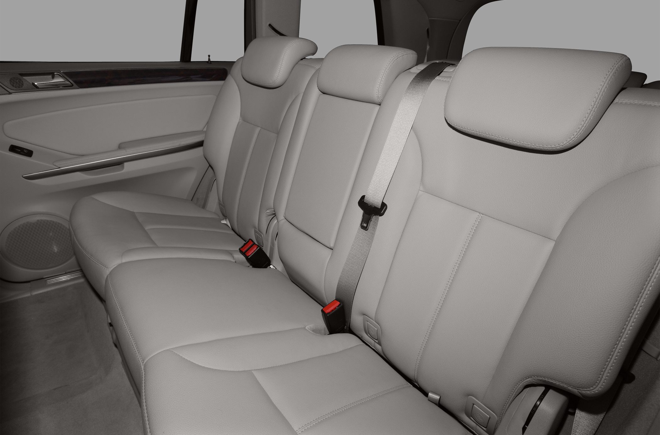 Rear seat with soft leather, headrests, and seat belts
