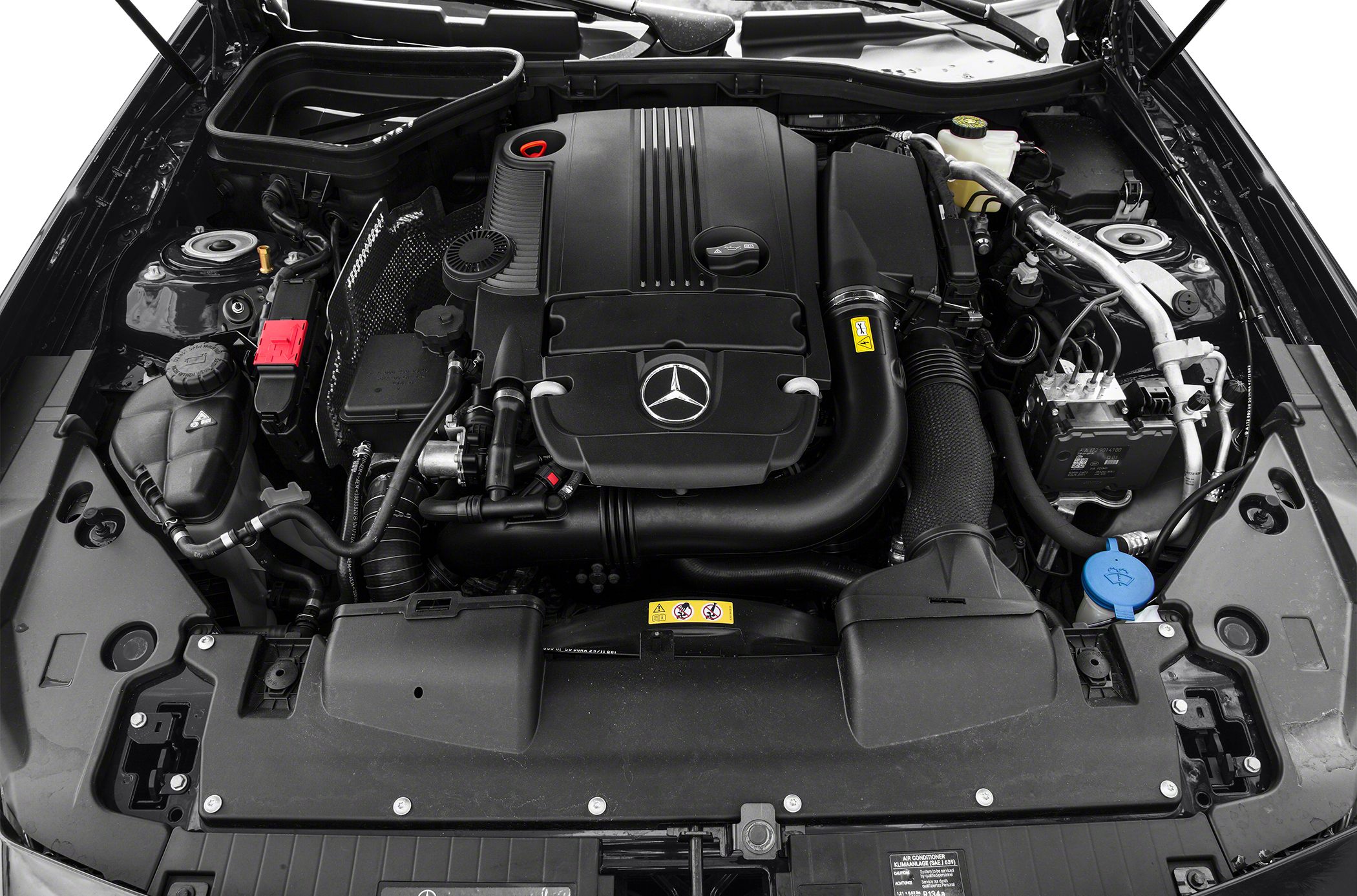 Engine bay with Mercedes-Benz emblem and visible components