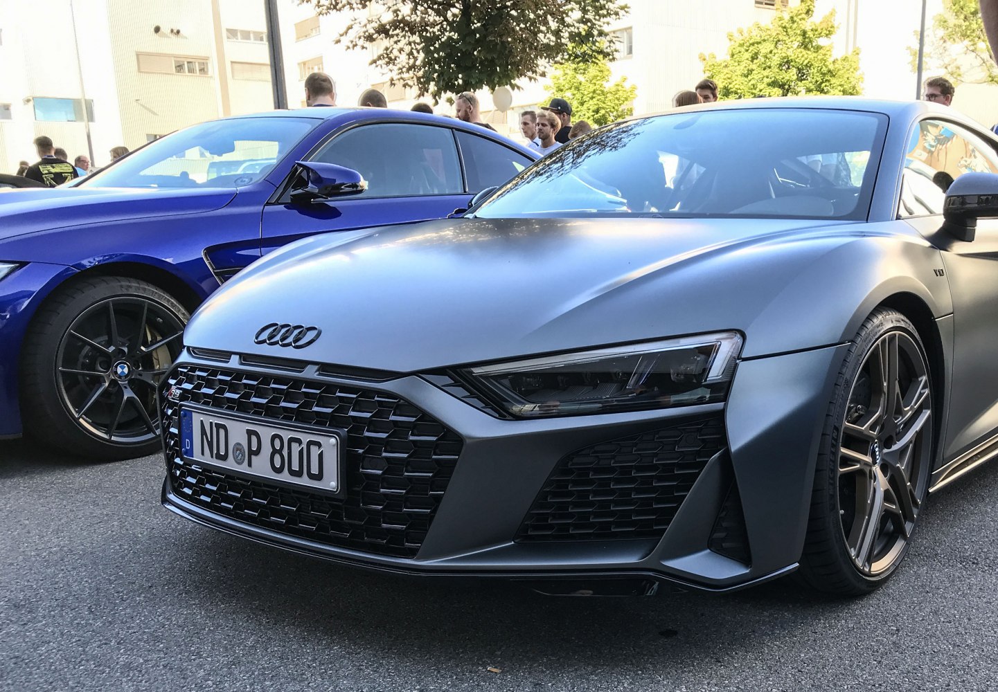 Front close-up showing aggressive grille and headlight design
