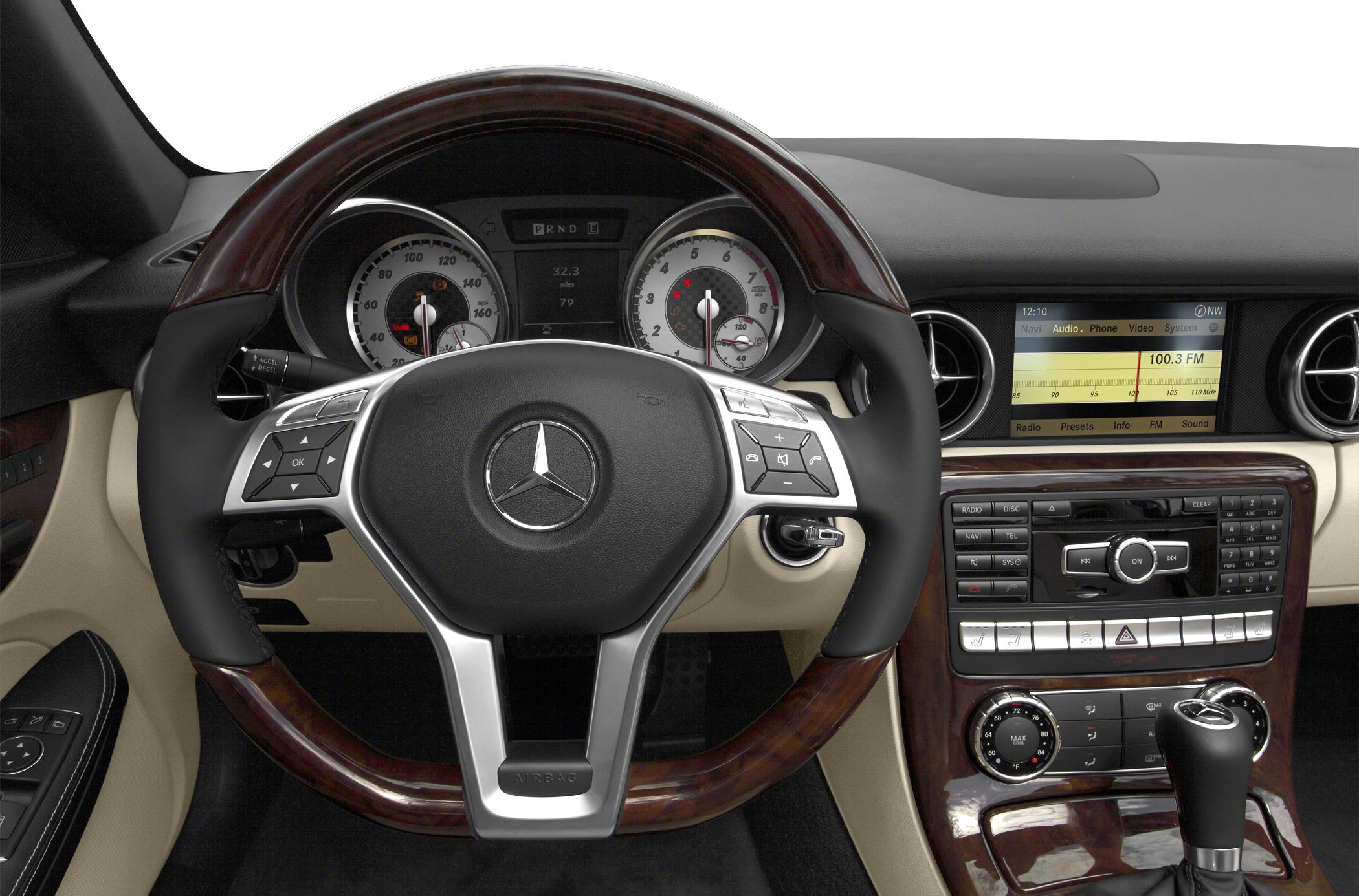 Multifunction steering wheel with wood trim and center console with multimedia controls.
