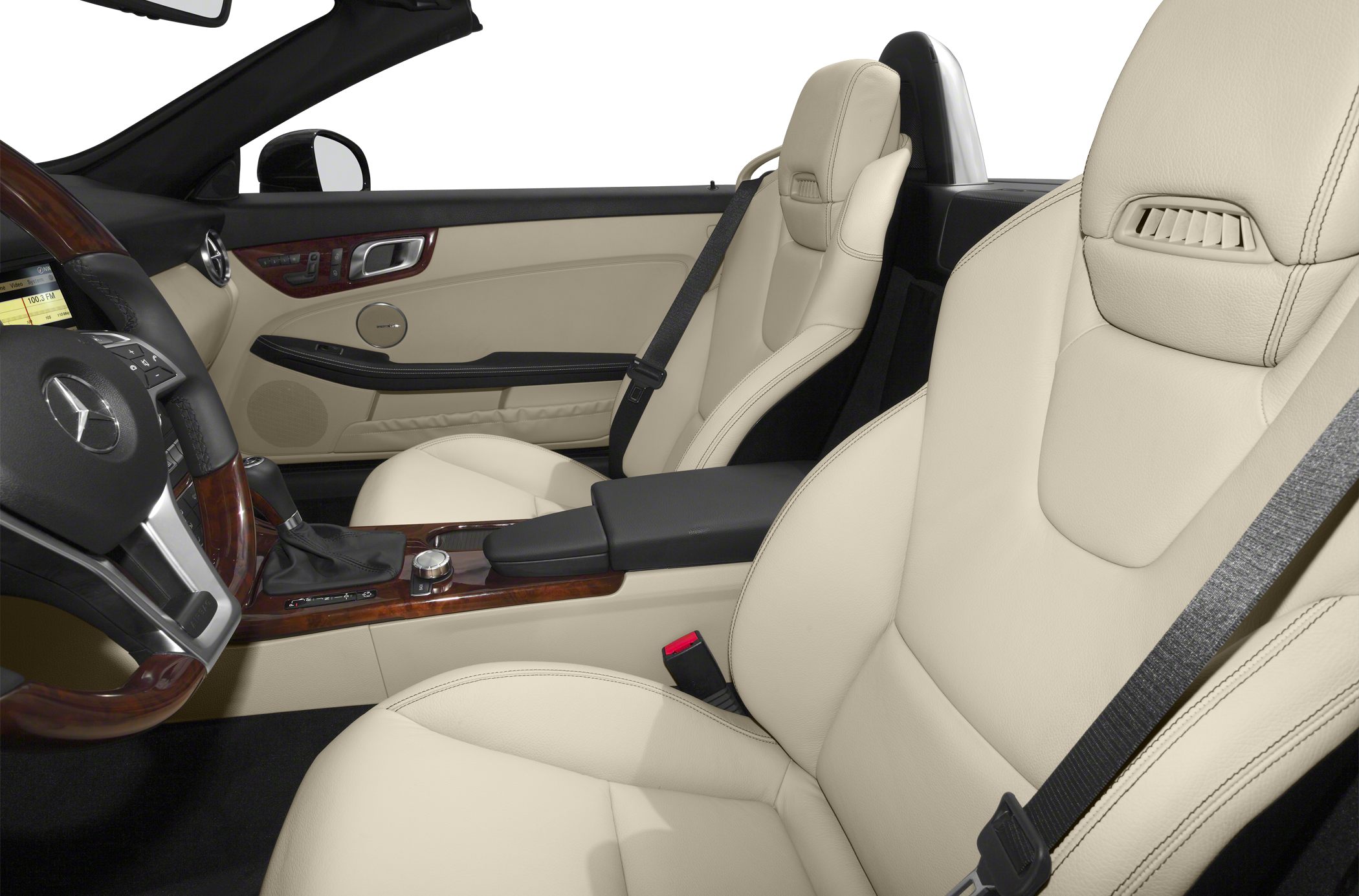 Beige leather seats and wood-trimmed center console with controls