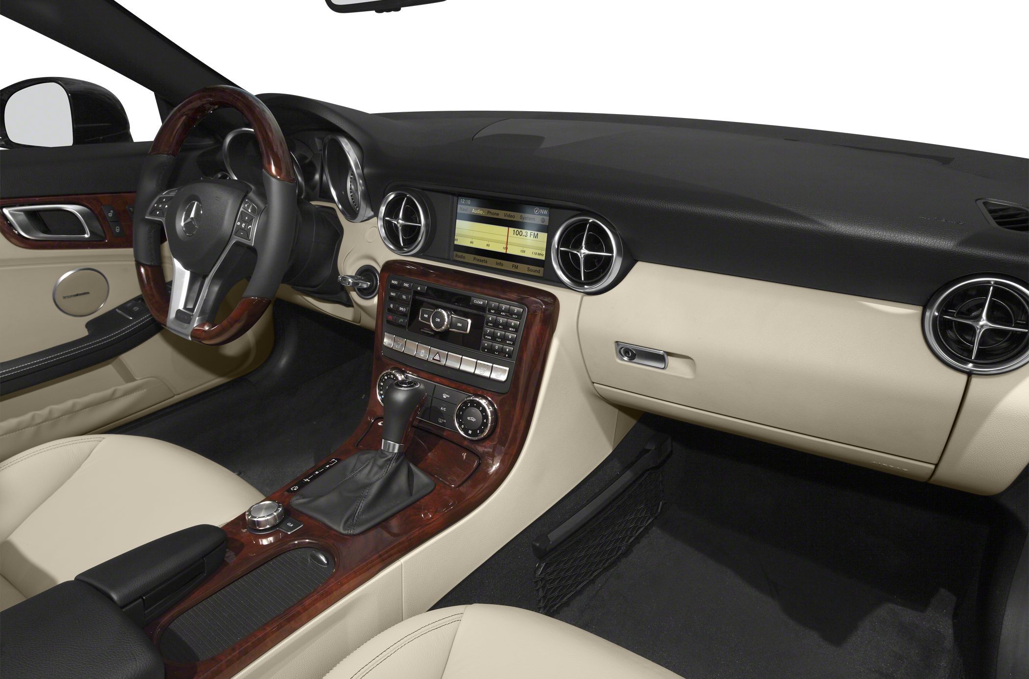 Wood-trimmed dashboard and multifunction steering wheel in luxury car interior