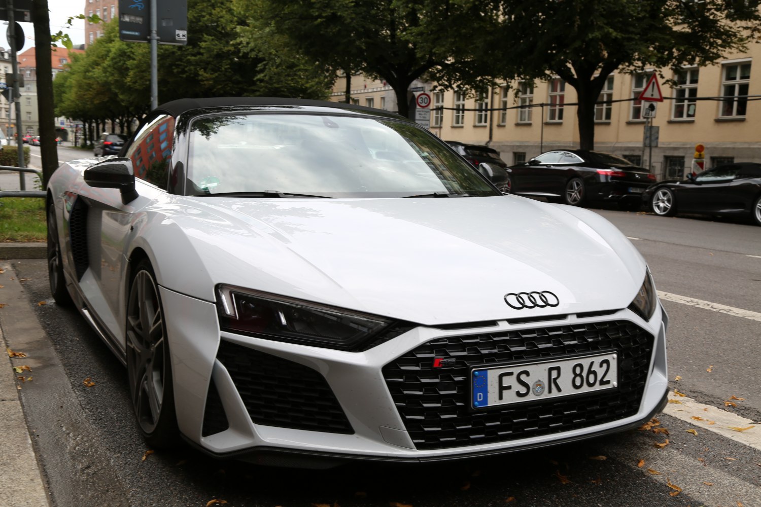 Front view of white Audi R8 II Spyder with LED headlights and aerodynamic design