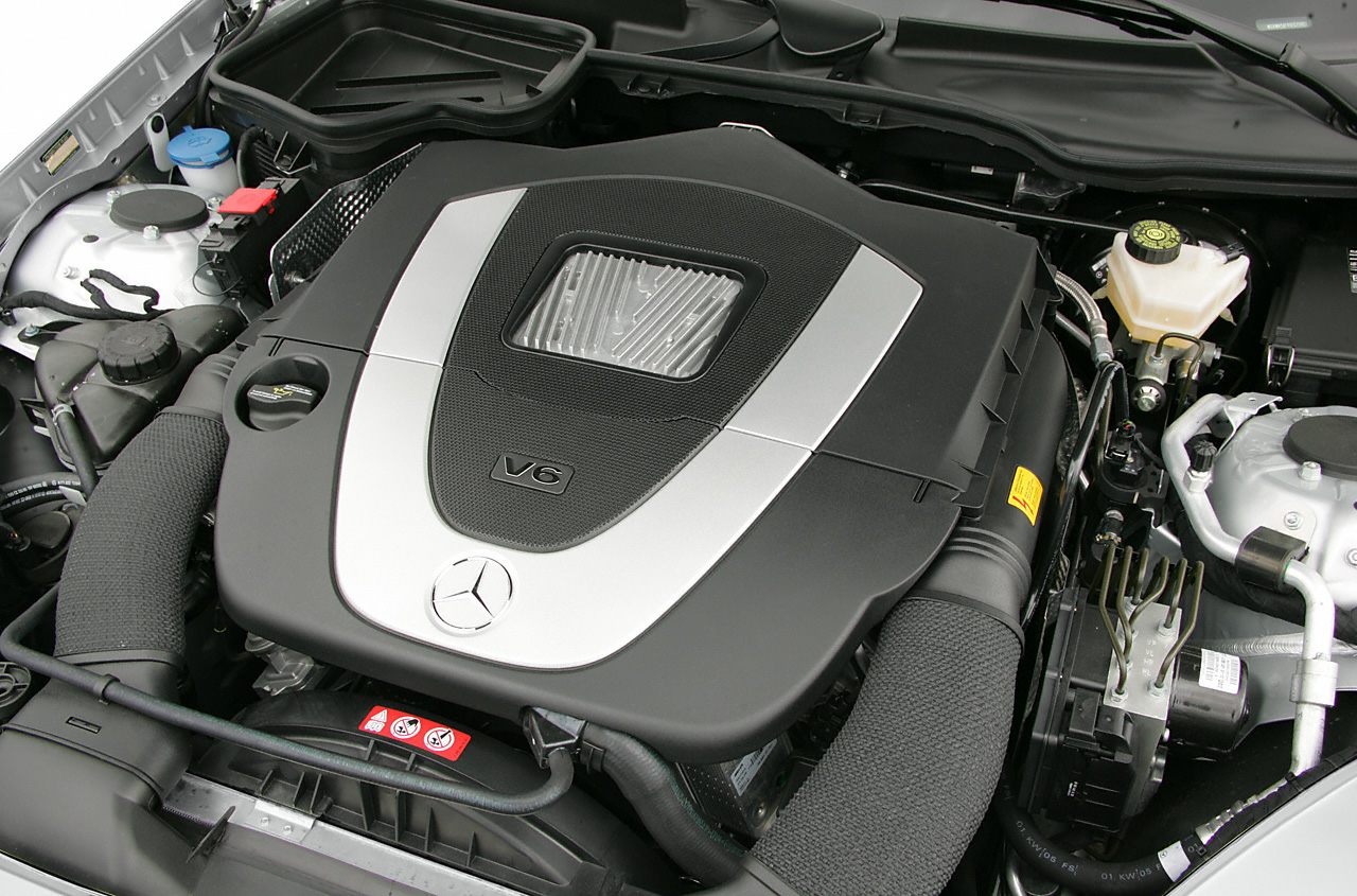 V6 engine cover with Mercedes-Benz emblem in engine bay