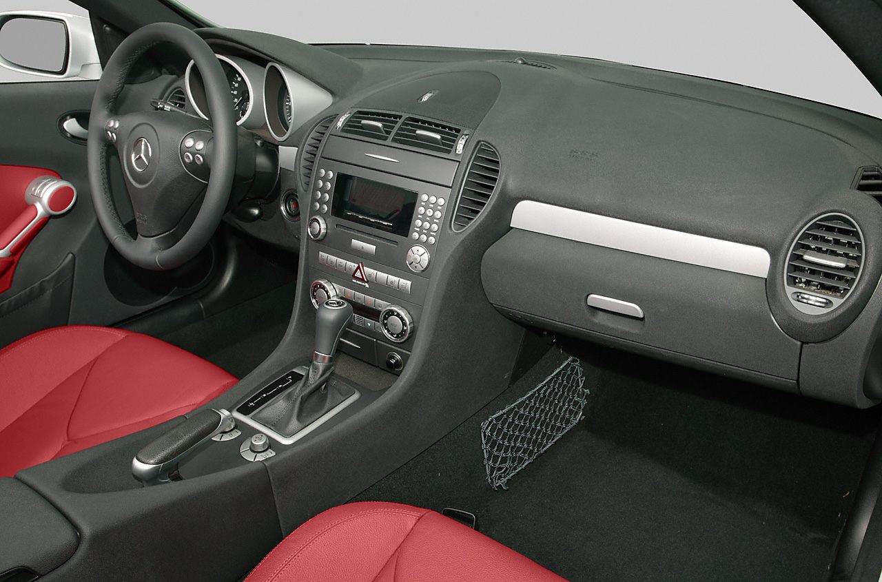 Dashboard and control panel with red leather seats interior