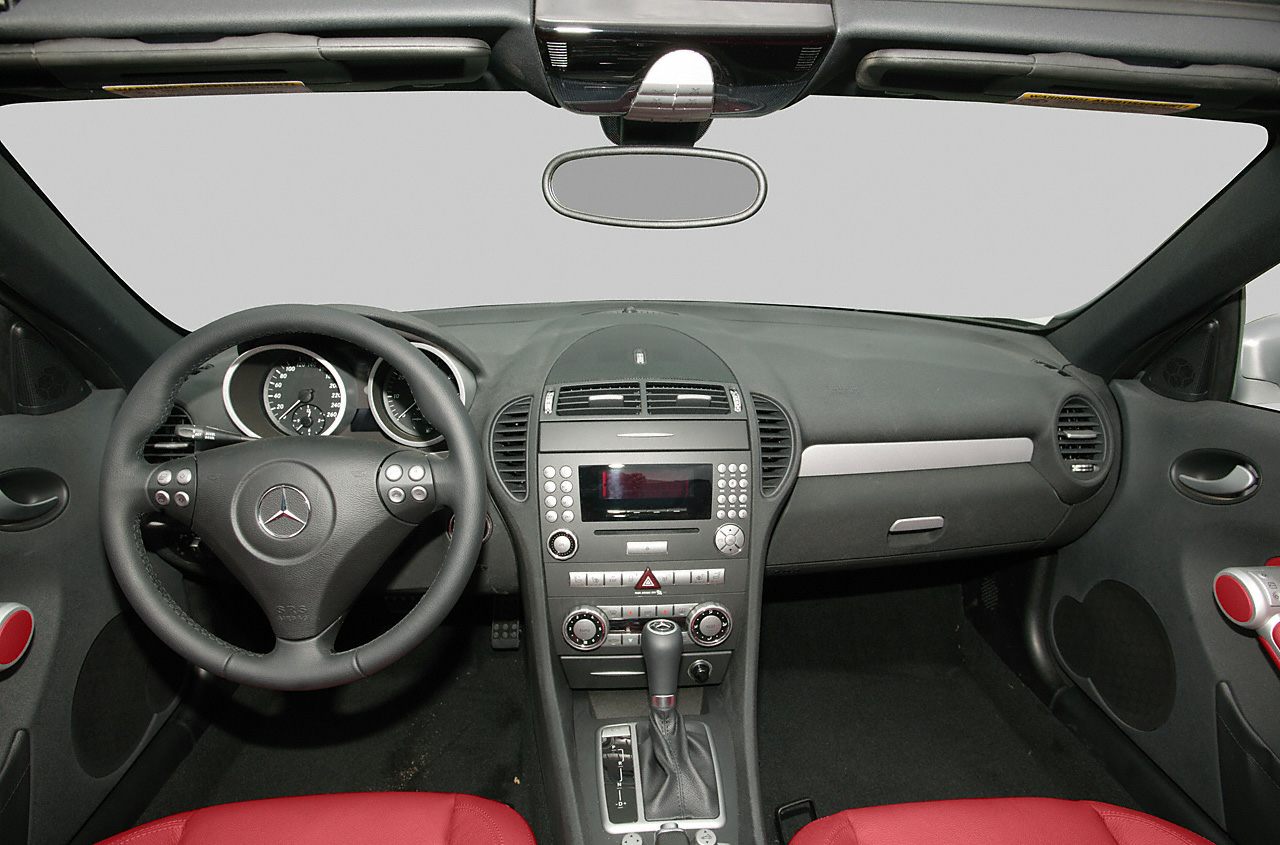 Interior dashboard and steering wheel with red seats