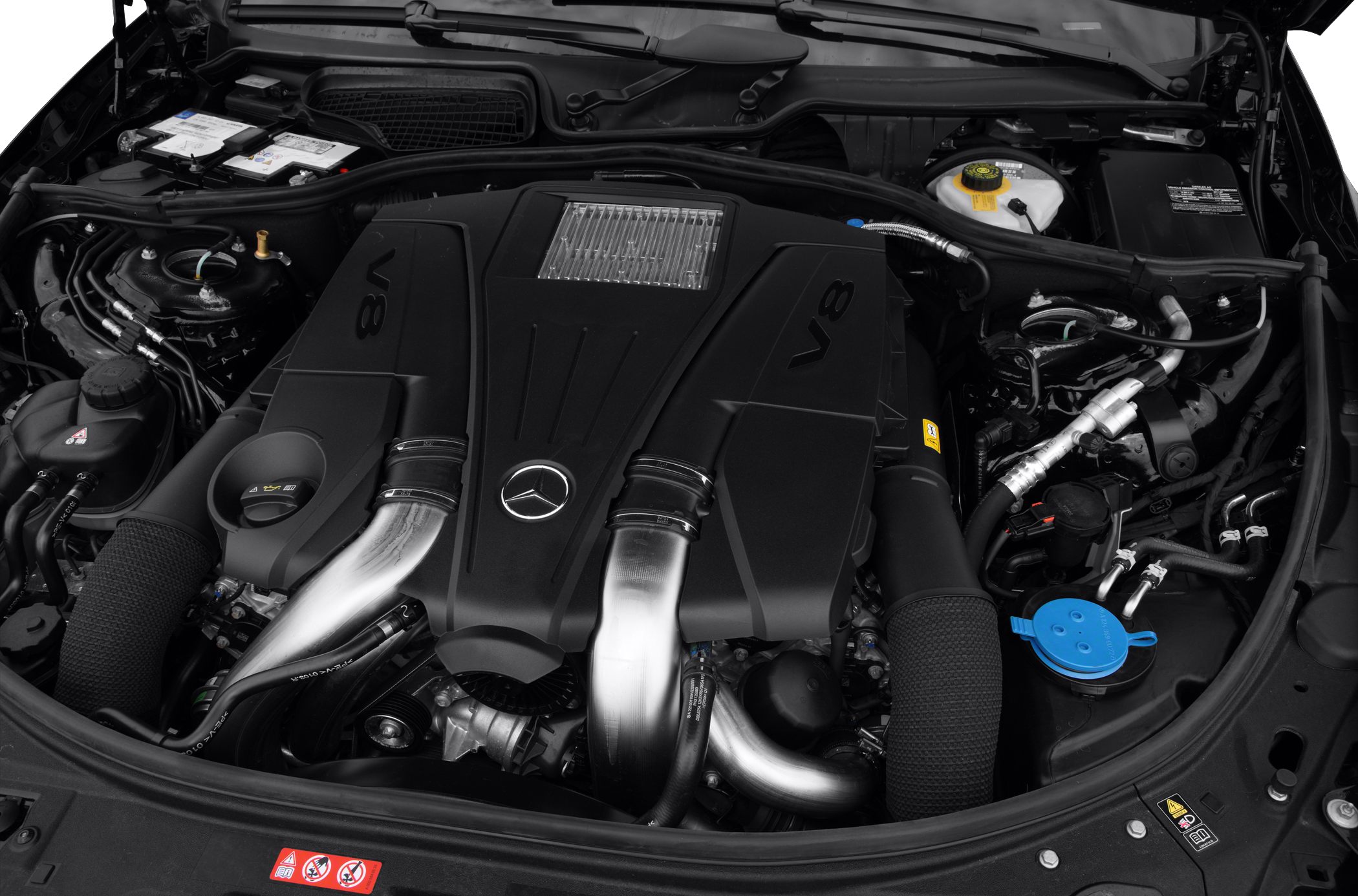 Close-up of V8 engine bay with Mercedes emblem and components