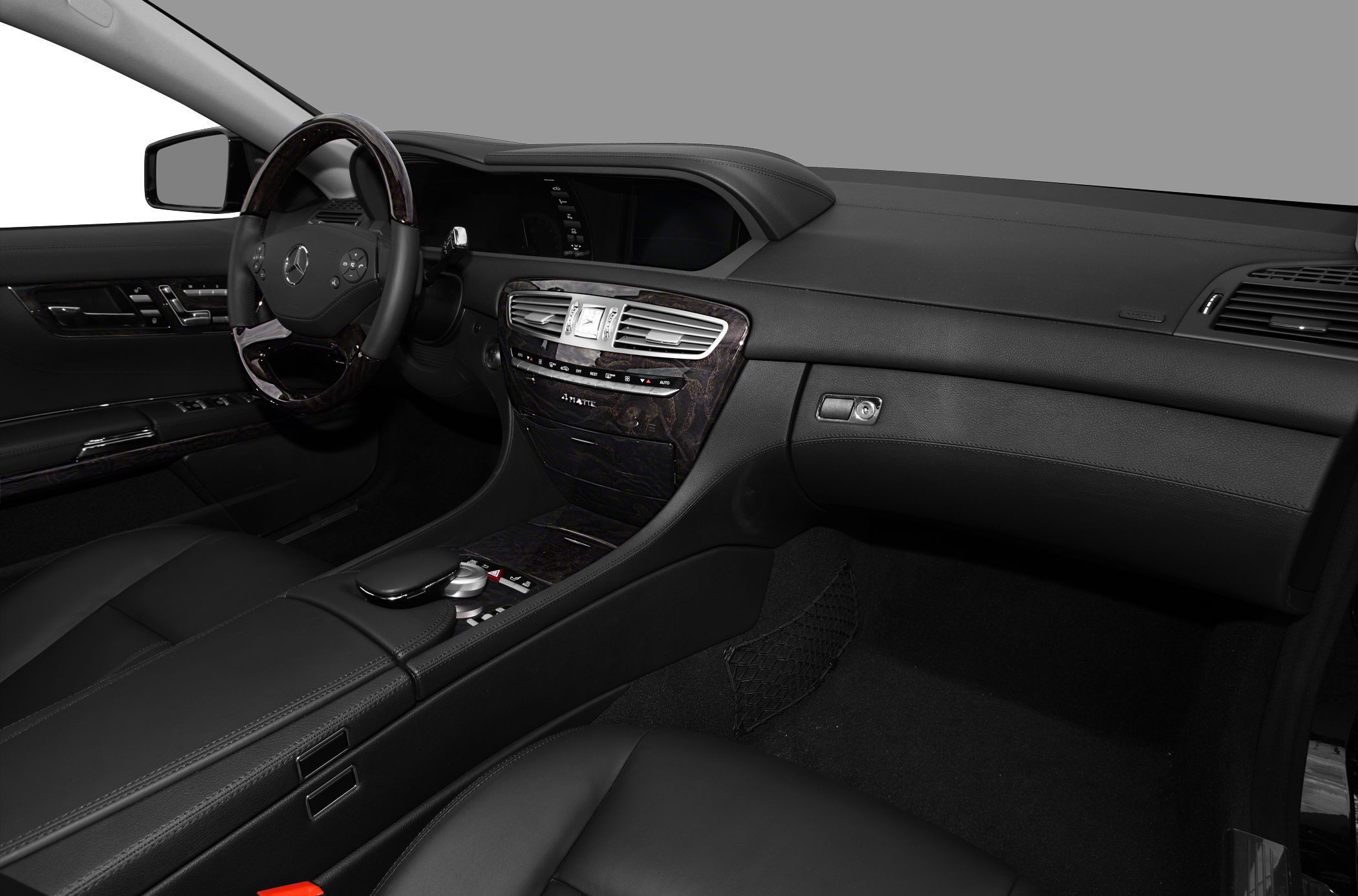 Luxury dashboard and steering wheel with wood trim and advanced controls