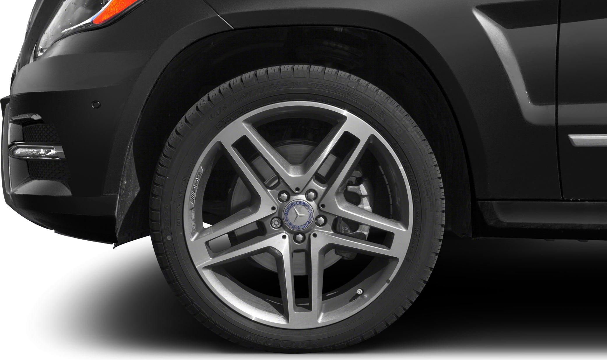 Alloy wheel and front fender close-up with detailed brake caliper.