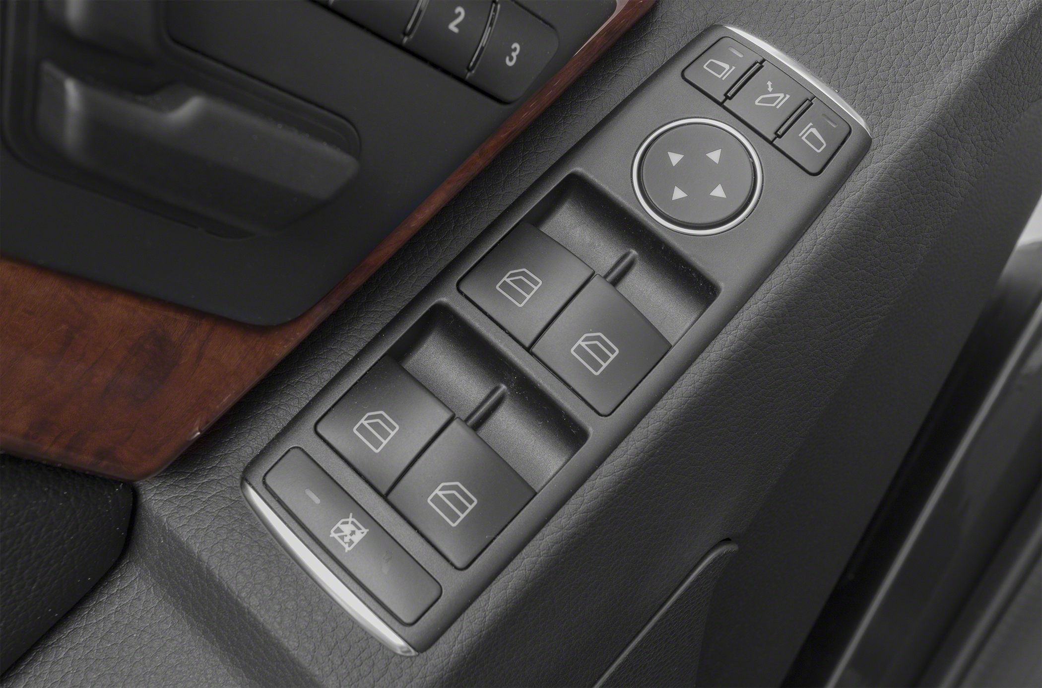 Power window and side mirror control panel with wood trim