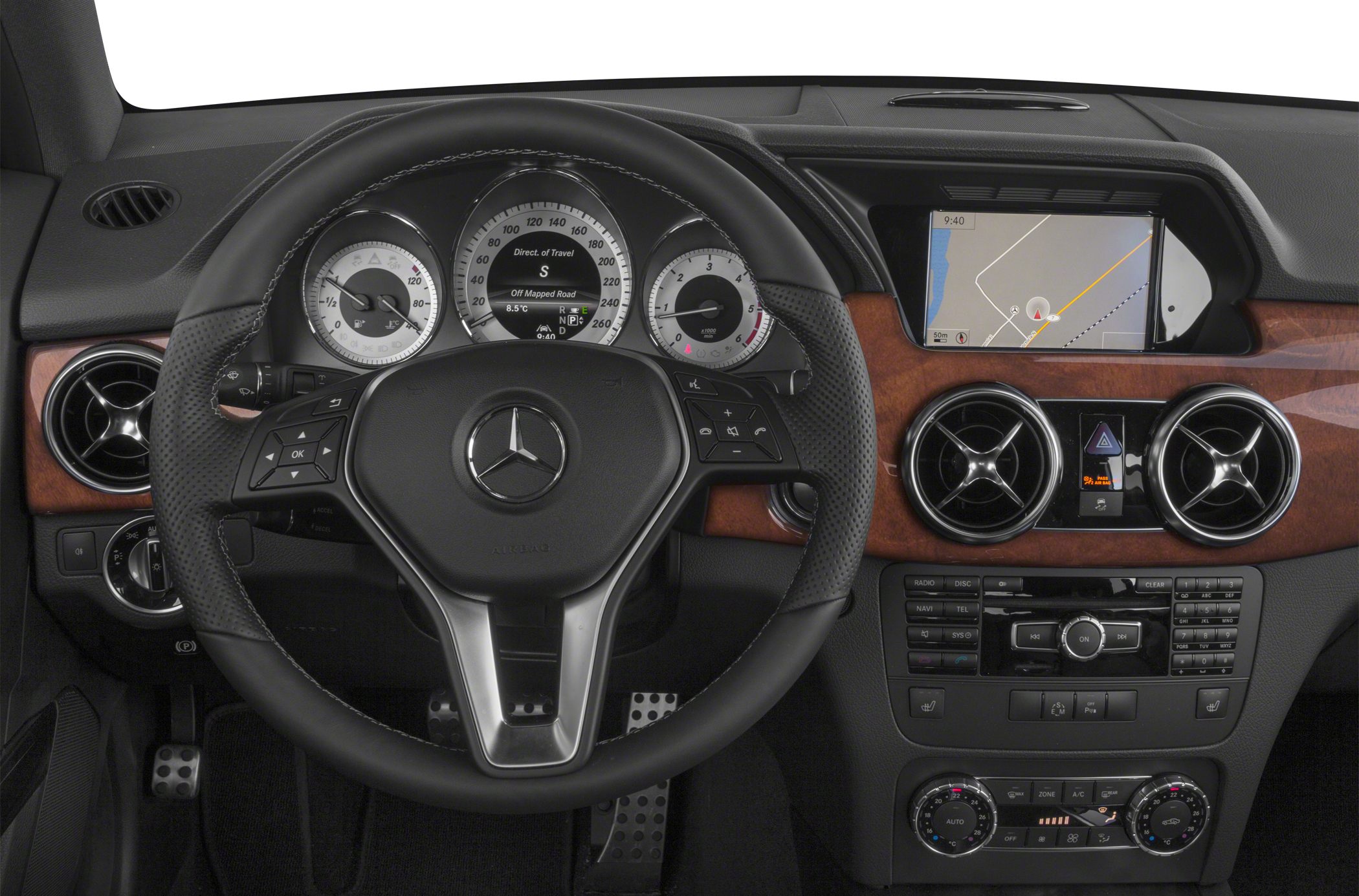Dashboard with steering wheel, instrument cluster, navigation screen, and wood trim