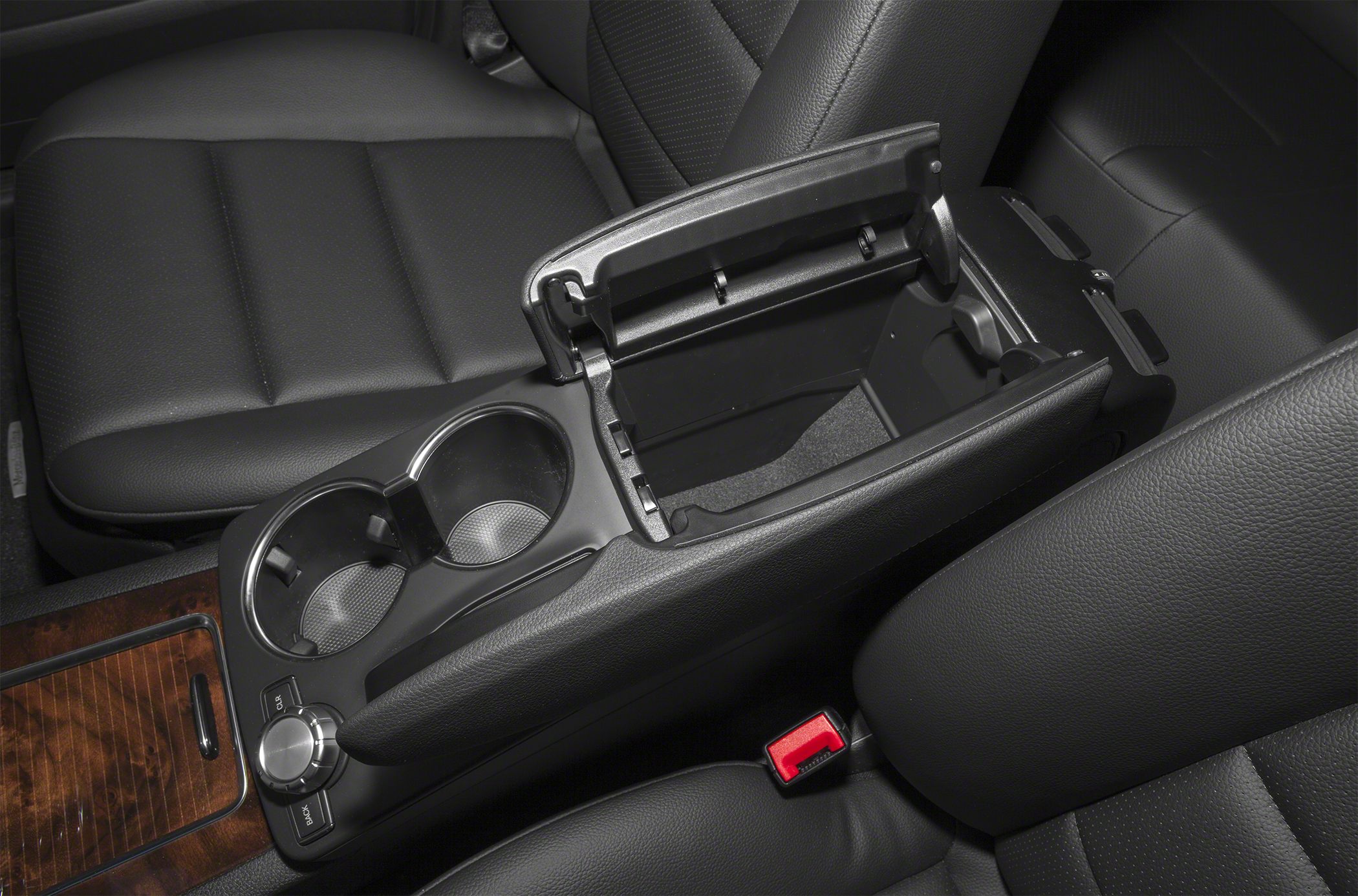 Center console with open storage compartment and cup holders