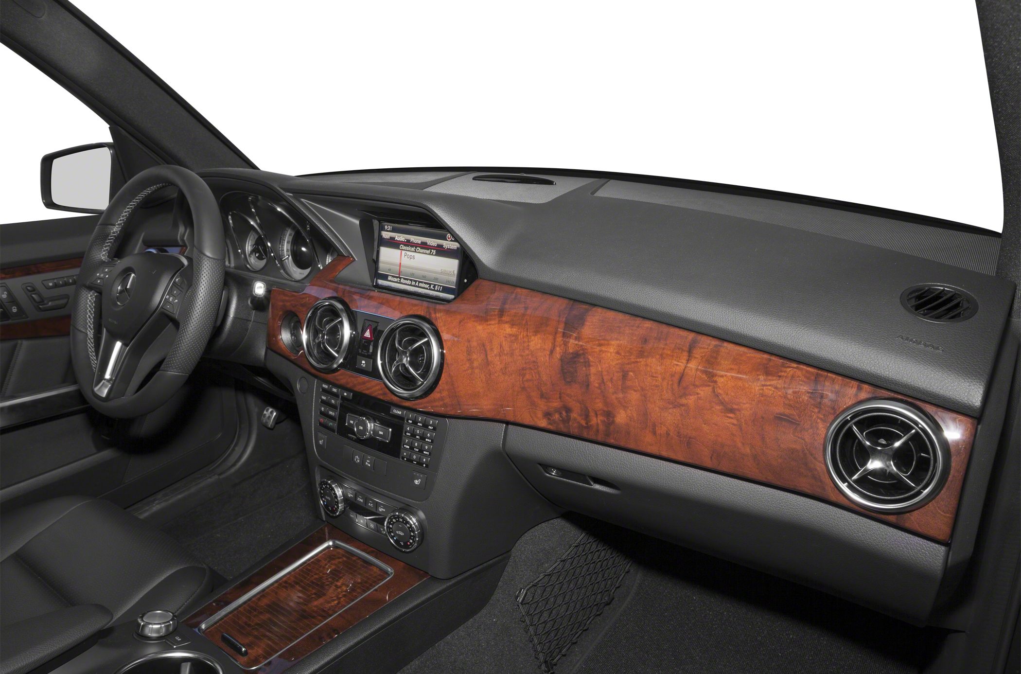 Wooden dashboard with circular air vents and advanced infotainment controls