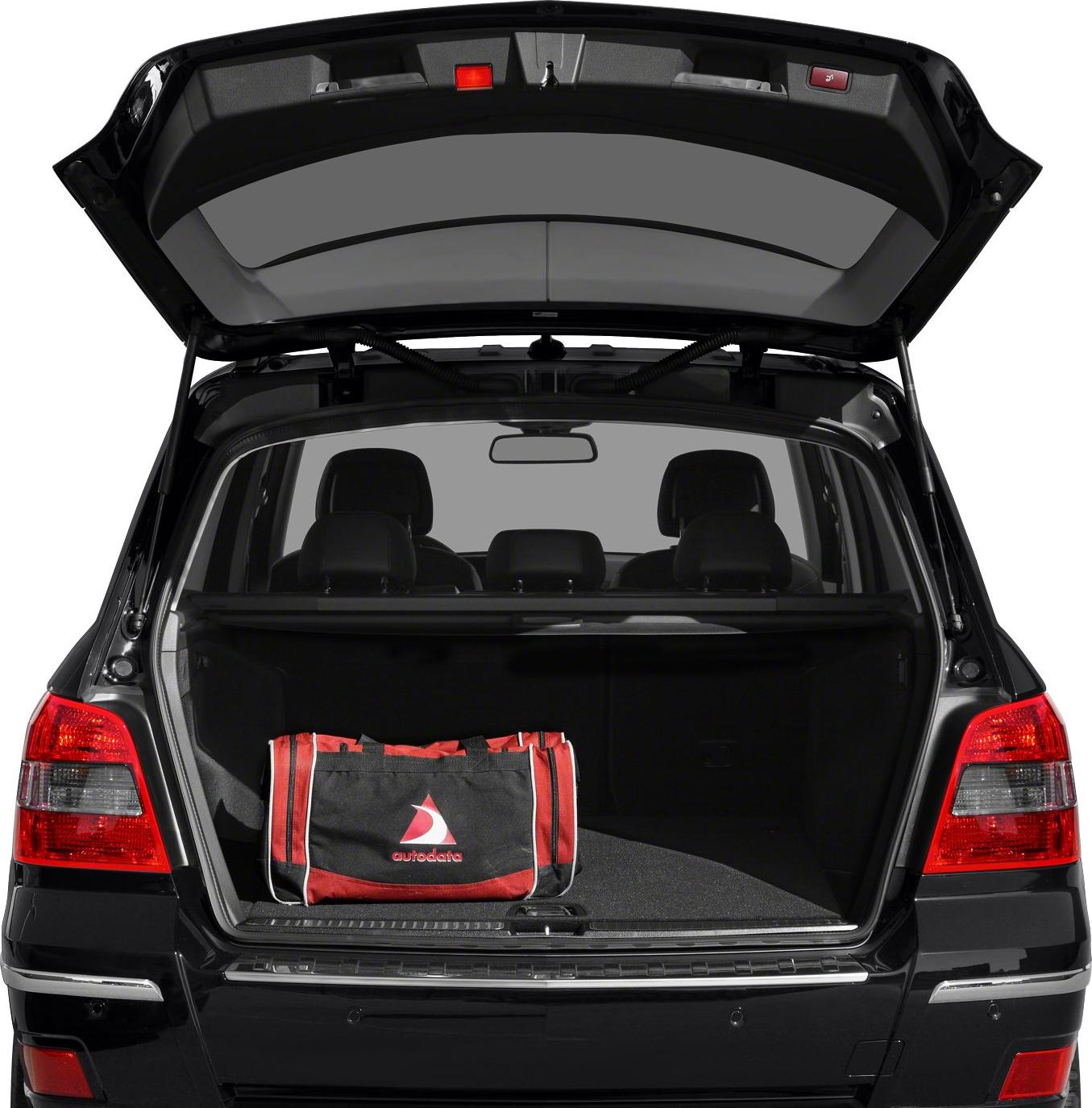 Open tailgate with spacious cargo area and red-black duffel bag inside an SUV.