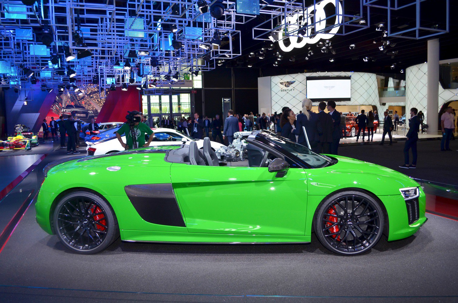 Green sports convertible with carbon side blade and black multi-spoke wheels