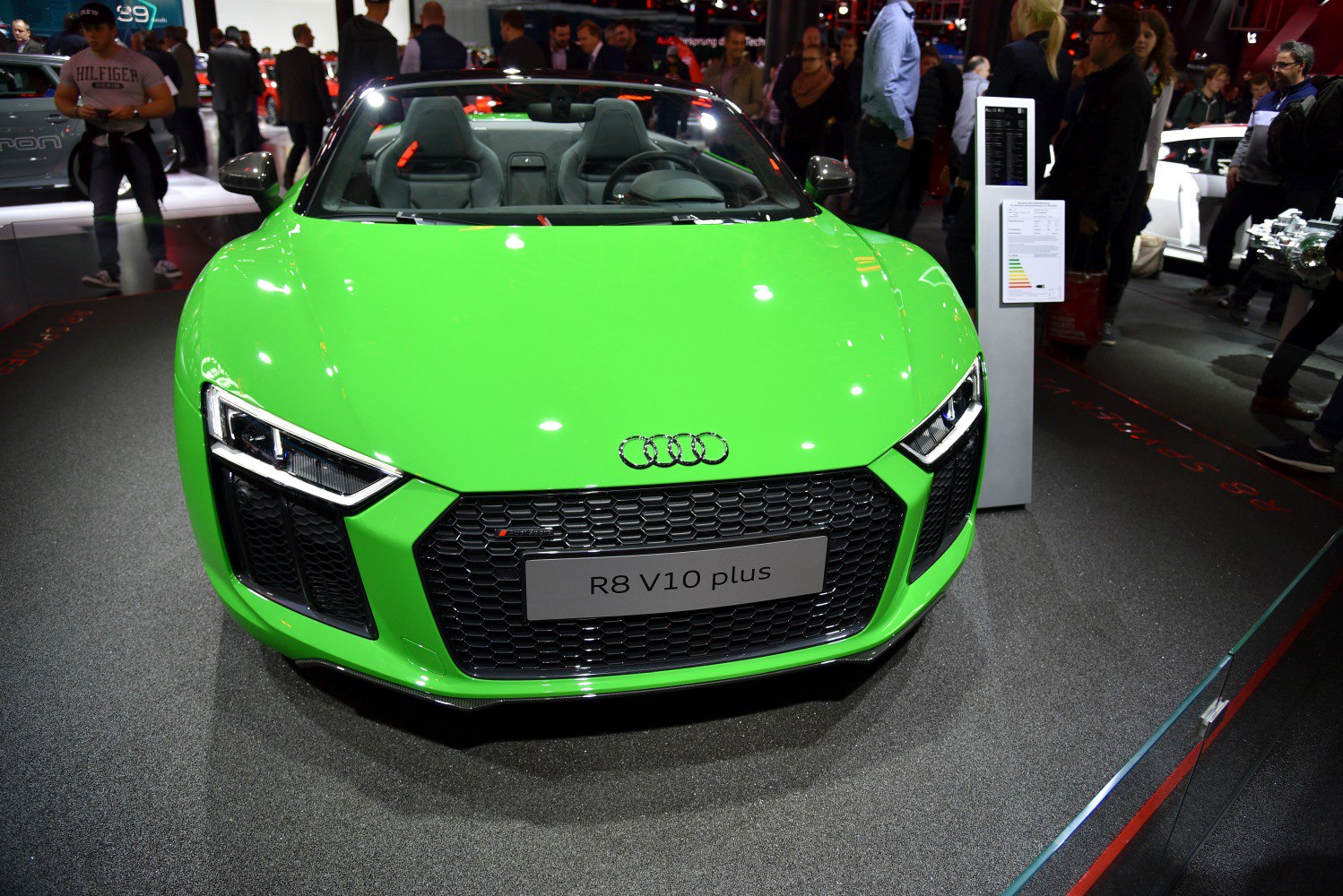 Front view of a green sports convertible with hexagonal grille and LED headlights