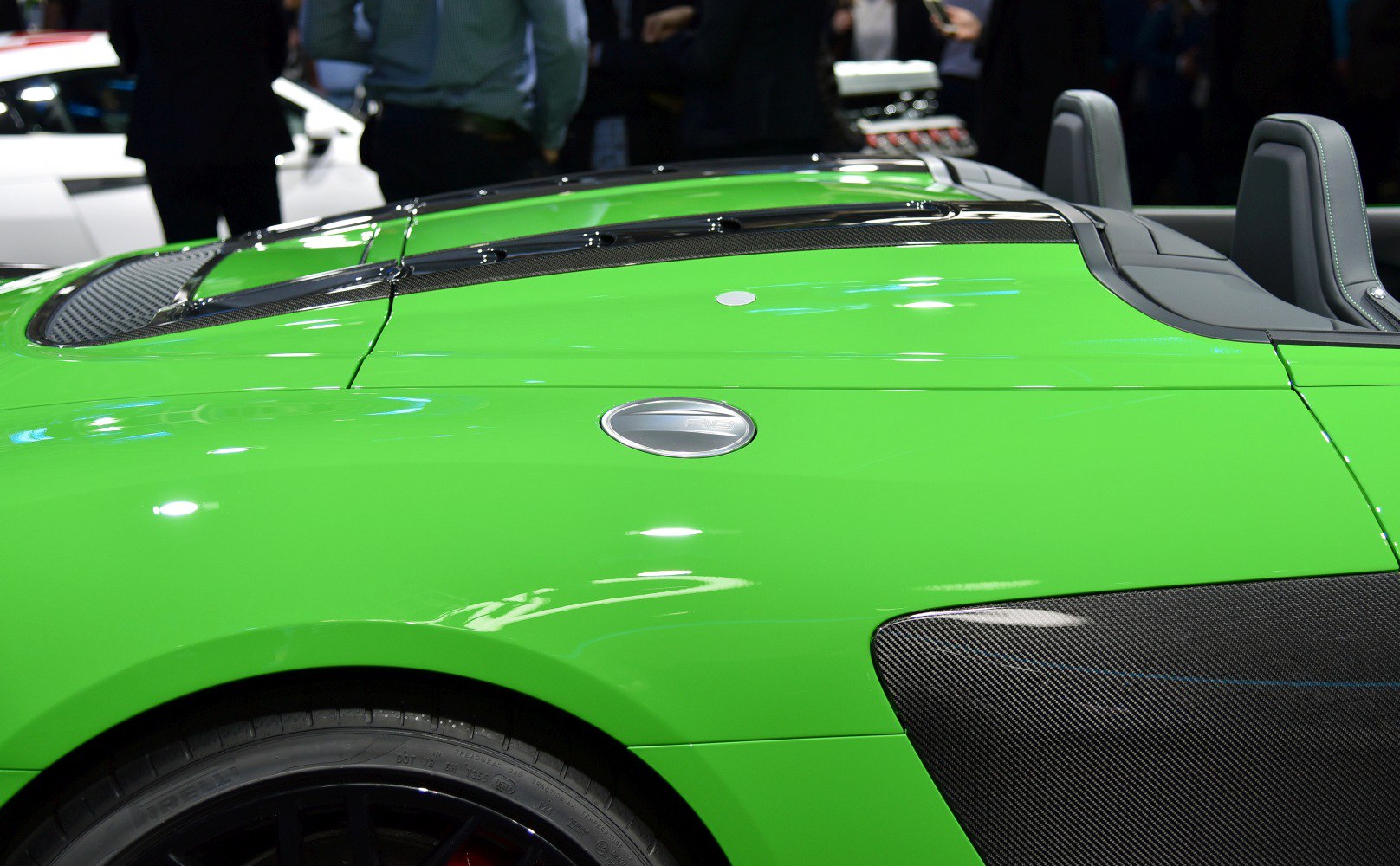 Green convertible side with carbon fiber vents and rear seating