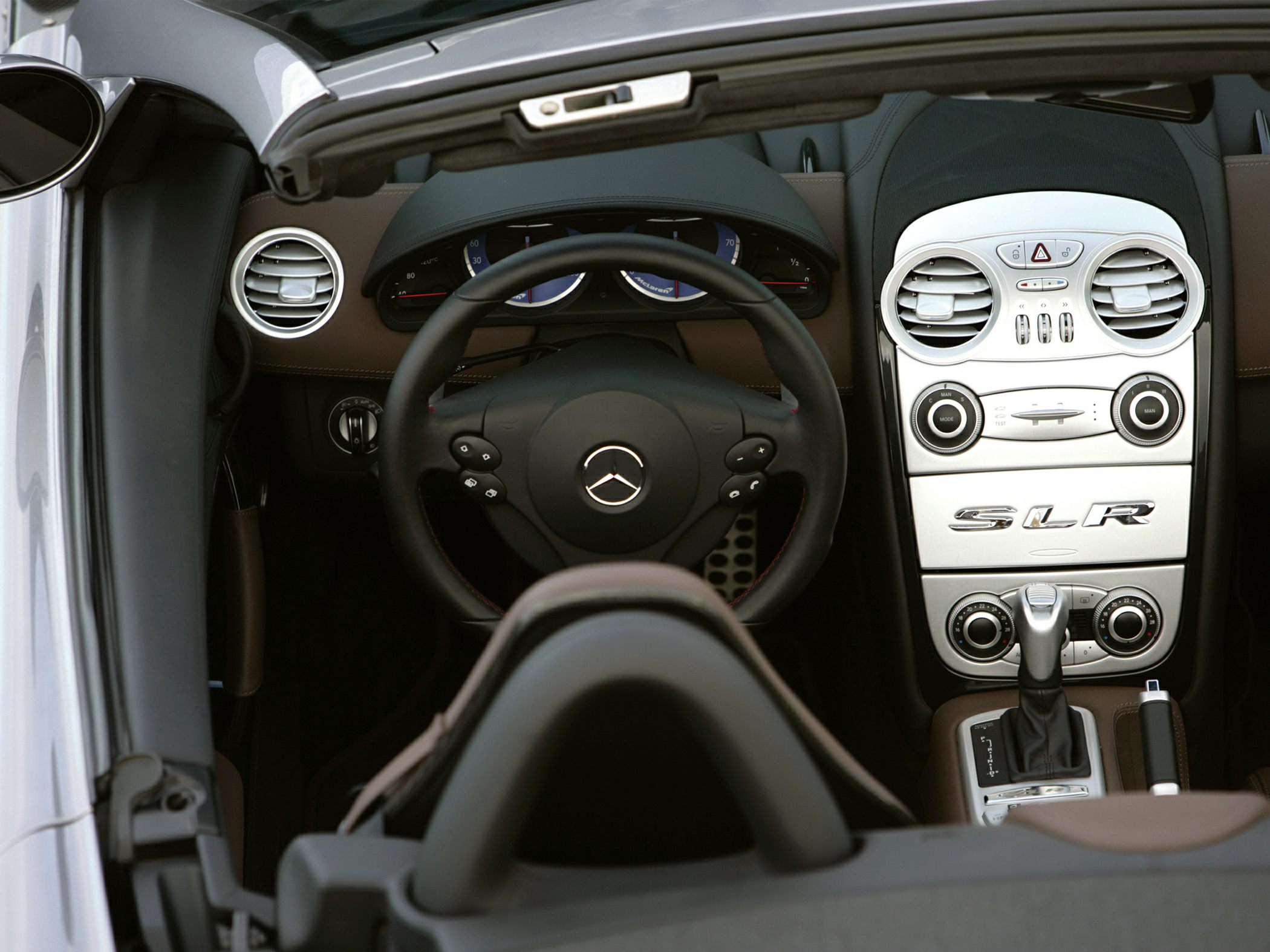 Luxury sports car interior with steering wheel and center console
