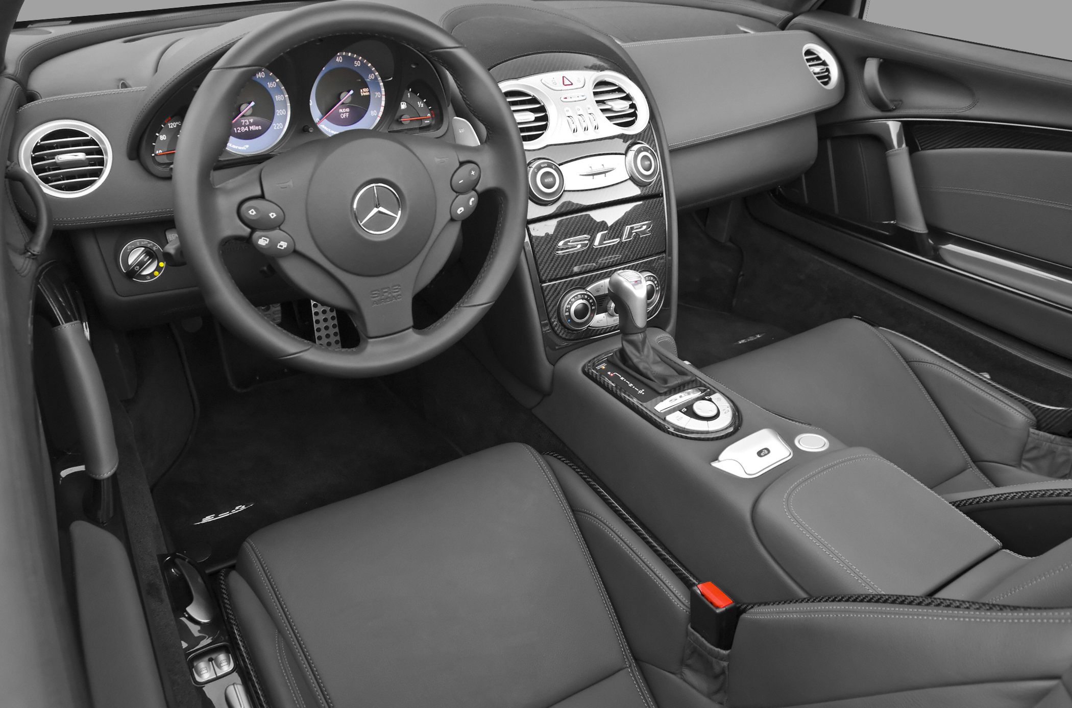 Dashboard and interior with carbon fiber trim and steering wheel