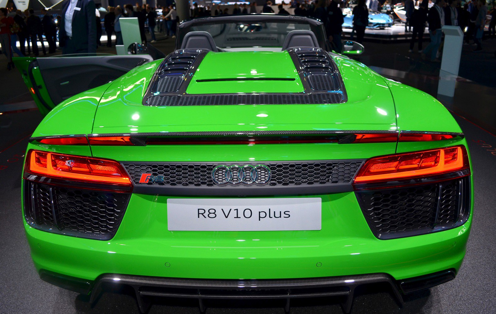 Green rear view of a high-performance convertible with LED taillights and carbon fiber vents