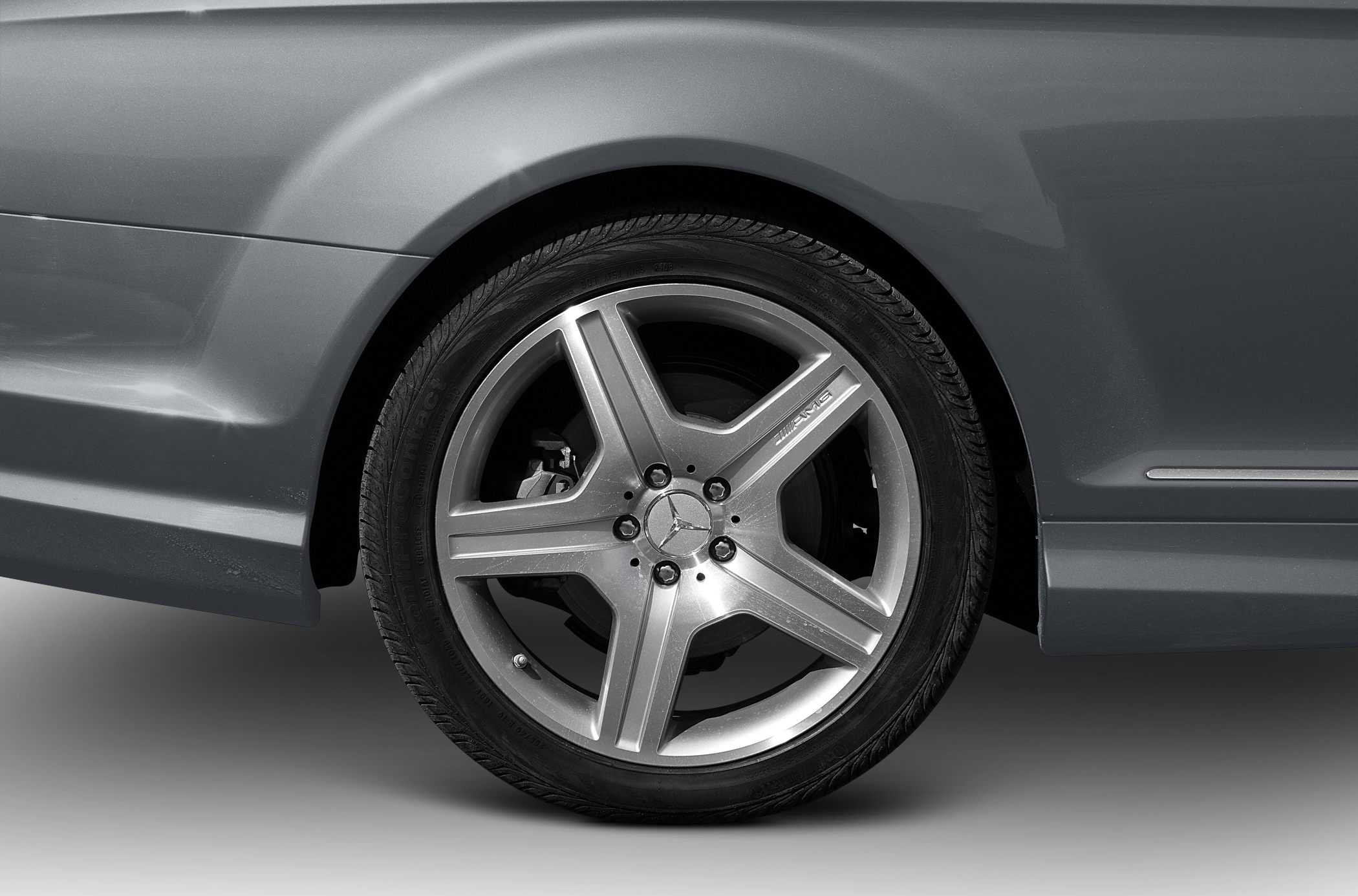 Close-up of AMG five-spoke alloy wheel and tire