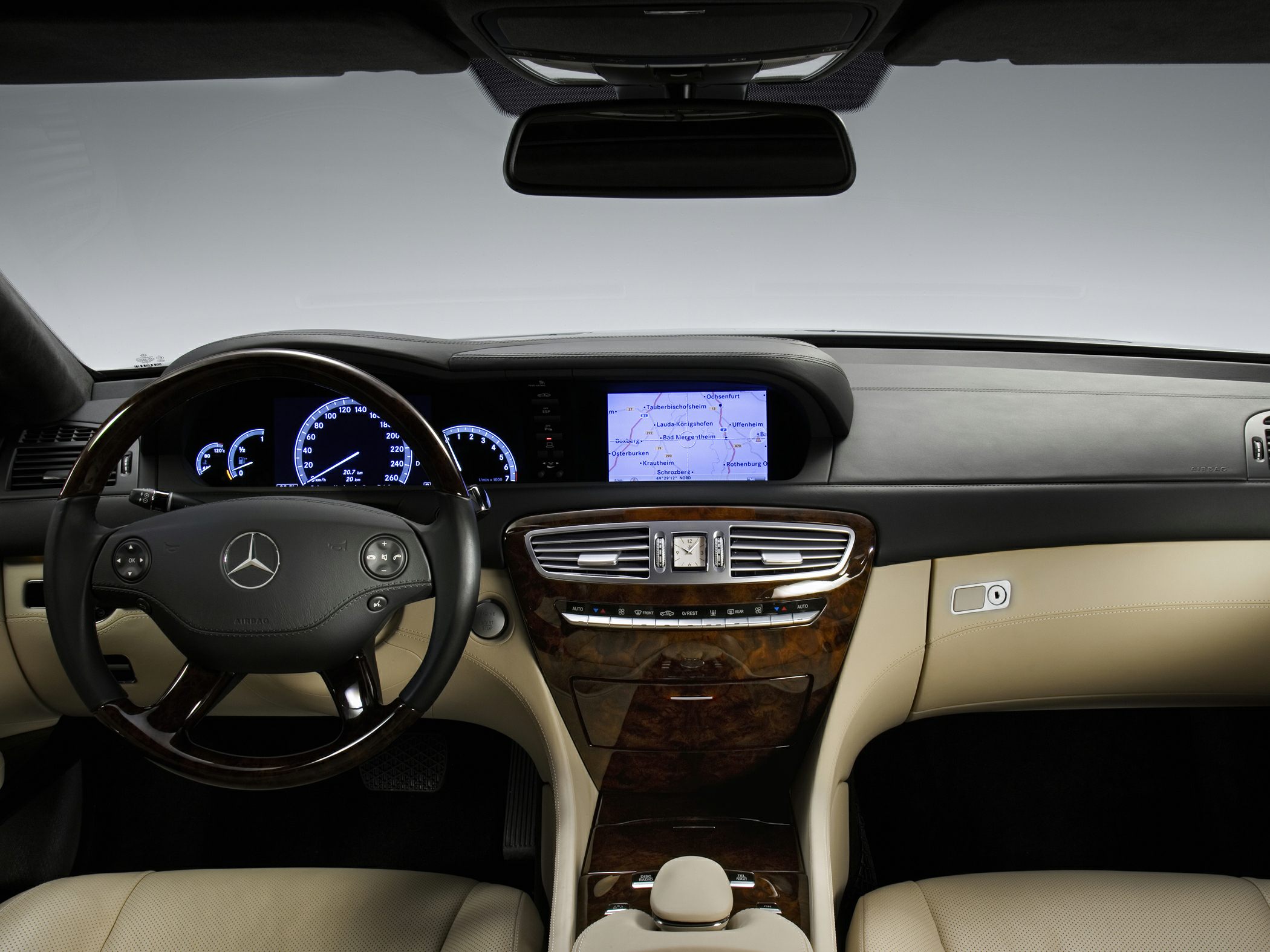 Wood-trimmed dashboard with digital display and navigation screen