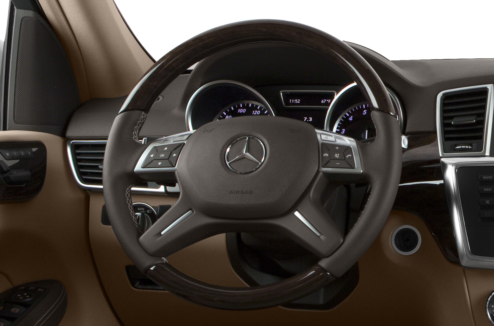 Steering wheel and dashboard with instrument cluster and control buttons.
