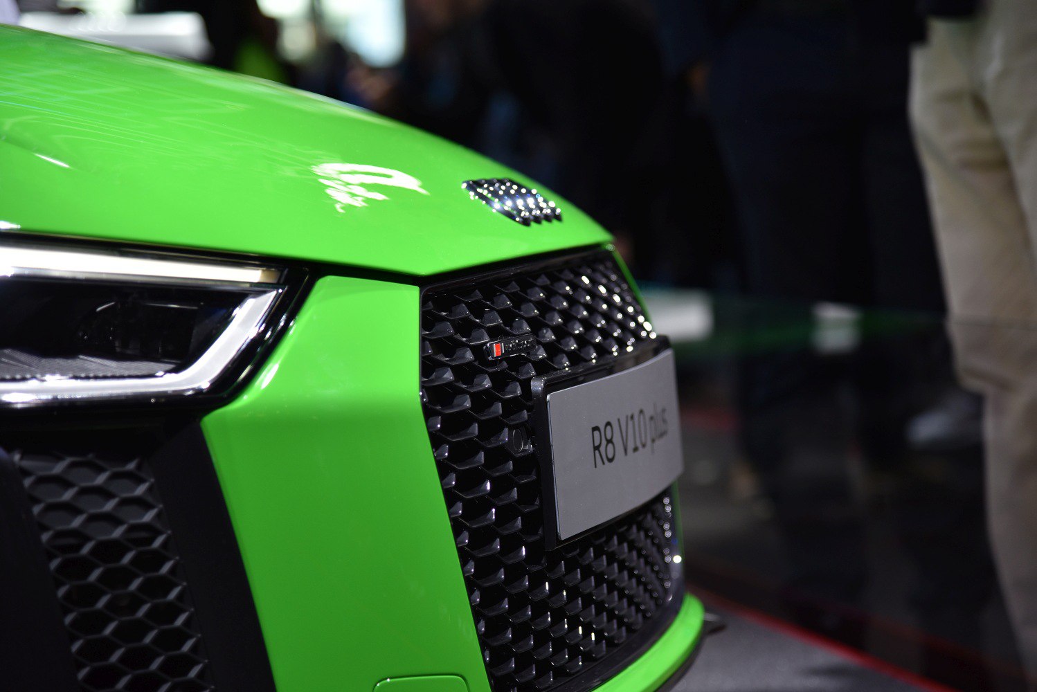 Front grille and headlight close-up with LED daytime running lights.