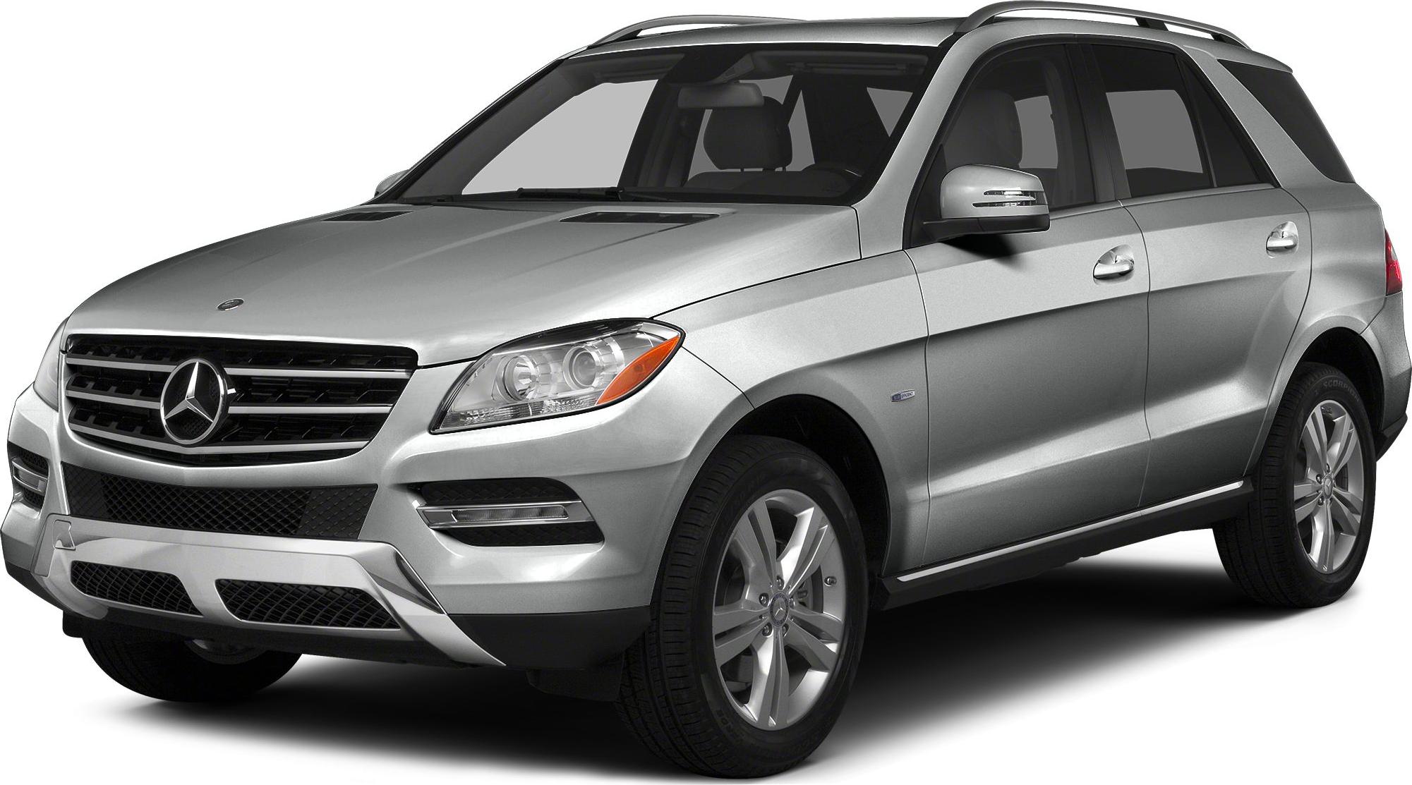 Front side view of silver luxury SUV with prominent grille and headlights