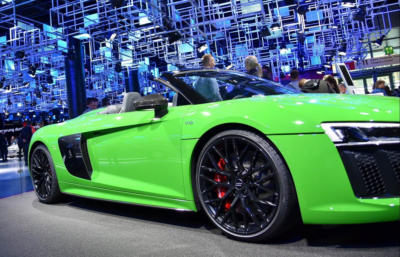Green convertible with black multi-spoke wheels and carbon side blade