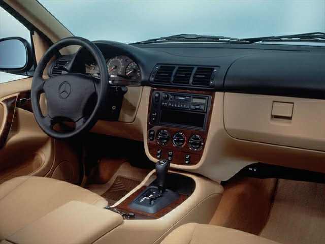 Dashboard, steering wheel, center console in beige interior