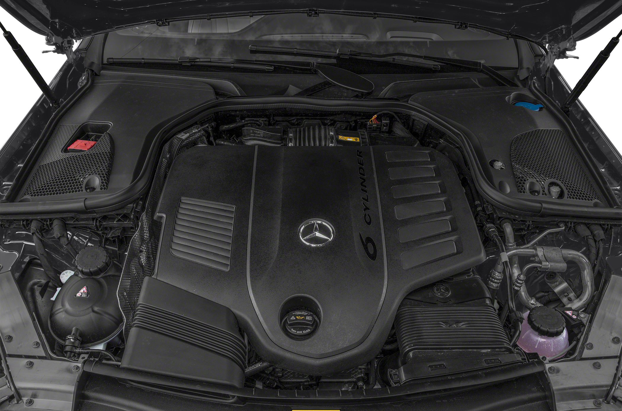 Close-up of a V6 cylinder engine with Mercedes-Benz emblem under car hood