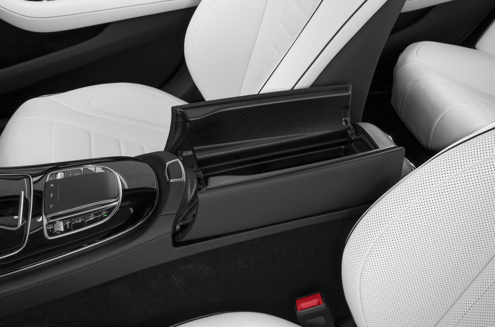 White perforated leather seats with center console storage compartment