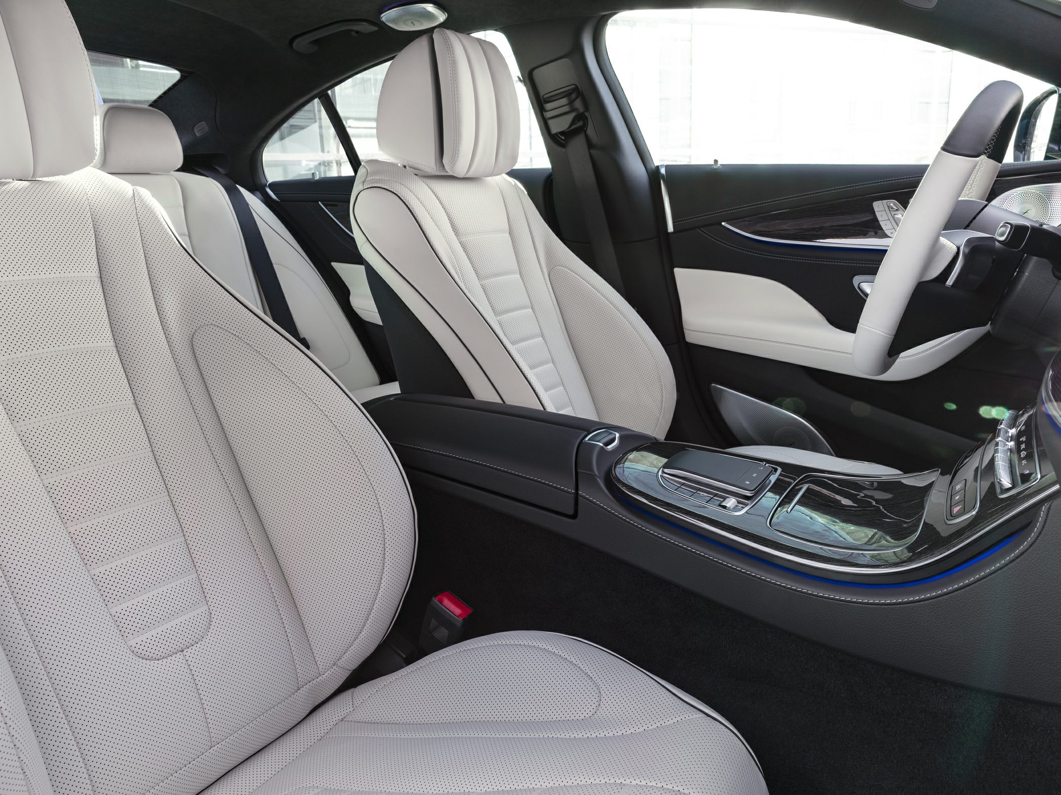 White perforated leather seats and black center console with ambient lighting