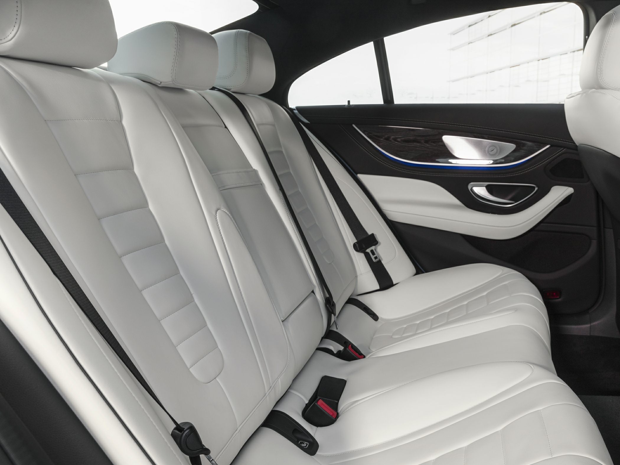 Rear white leather seats with modern luxury interior design